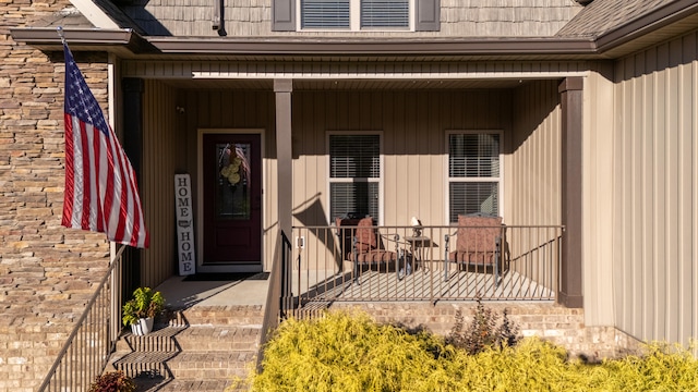 entrance to property featuring a porch