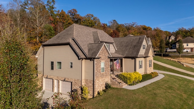 view of front of house with a garage and a front yard