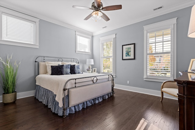 bedroom featuring ceiling fan, dark hardwood / wood-style flooring, and crown molding