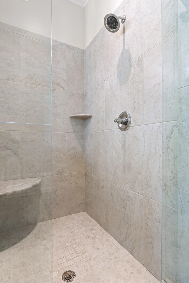 bathroom with tiled shower