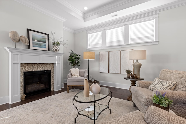 living room featuring dark hardwood / wood-style floors and ornamental molding