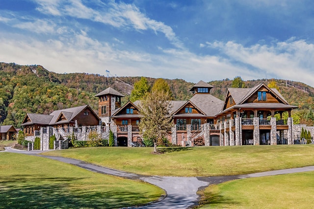 view of home's community with a lawn