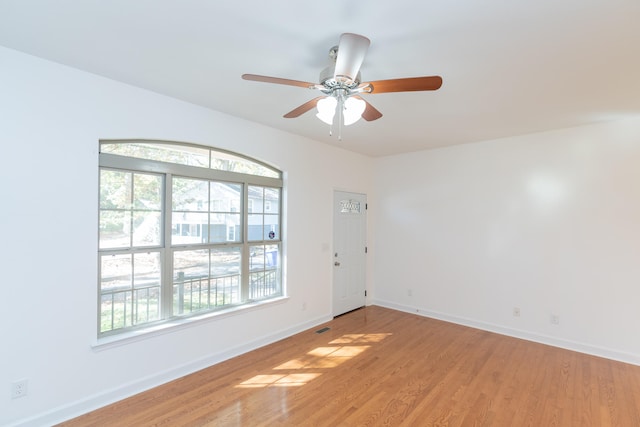 unfurnished room with ceiling fan and light hardwood / wood-style floors