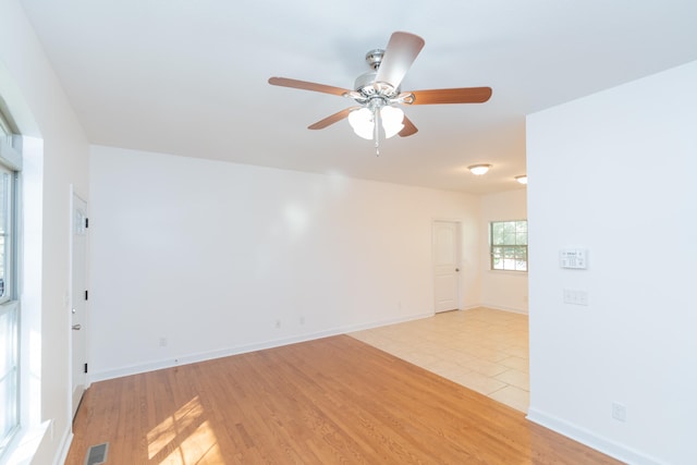 spare room with ceiling fan and light hardwood / wood-style flooring