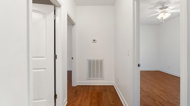 corridor featuring dark wood-type flooring