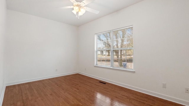 unfurnished room with hardwood / wood-style flooring and ceiling fan