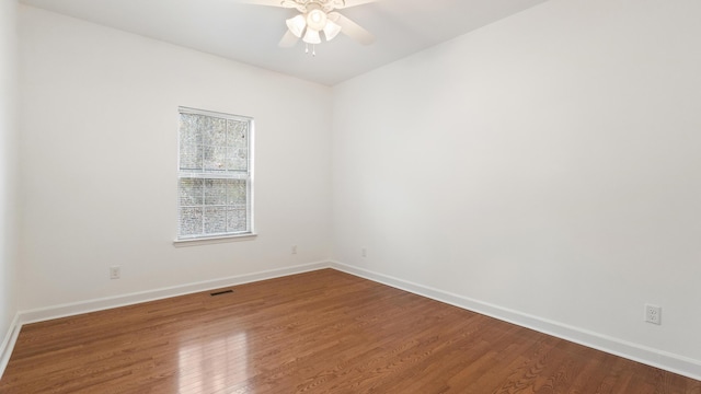 empty room with wood-type flooring and ceiling fan