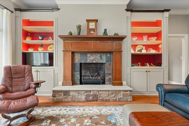 4014 Hawks Way NE, Huntsville, AL 35811 - living area with wood finished floors, built in features, a stone fireplace, and crown molding