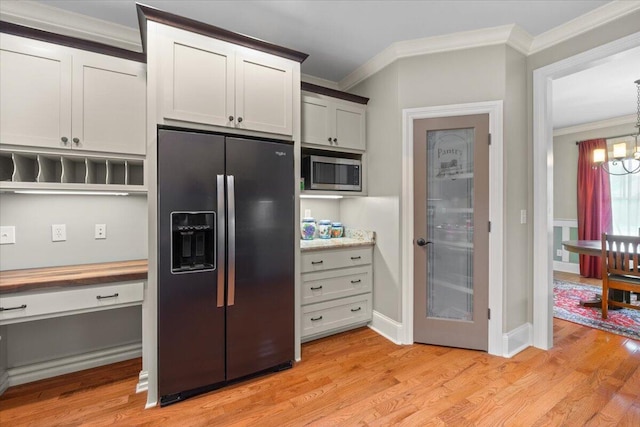 4014 Hawks Way NE, Huntsville, AL 35811 - kitchen featuring refrigerator with ice dispenser, stainless steel microwave, crown molding, a chandelier, and light wood-type flooring