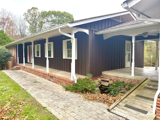 view of property exterior featuring covered porch