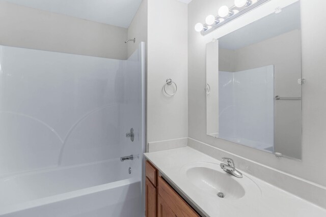 bathroom with vanity and shower / tub combination