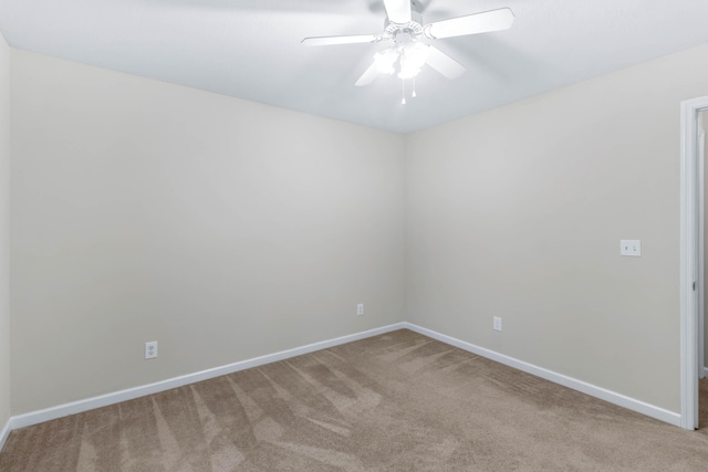 unfurnished room with carpet flooring and ceiling fan