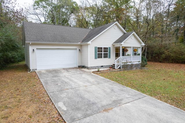 single story home featuring covered porch, a garage, and a front yard