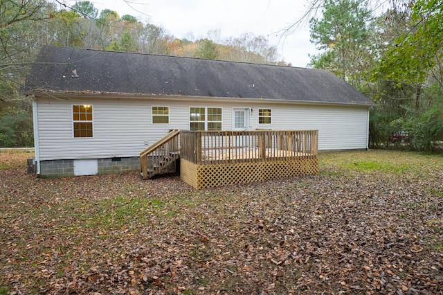 back of house with a wooden deck