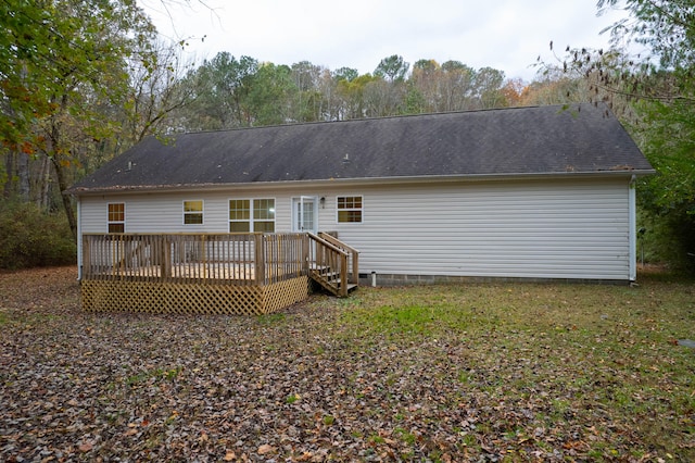 rear view of property featuring a deck