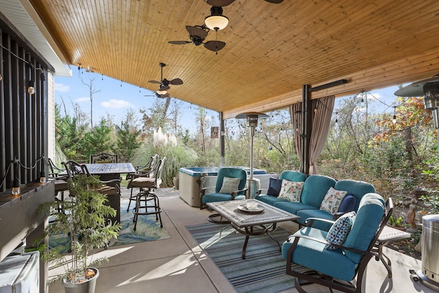 deck featuring ceiling fan, exterior bar, an outdoor hangout area, and a patio