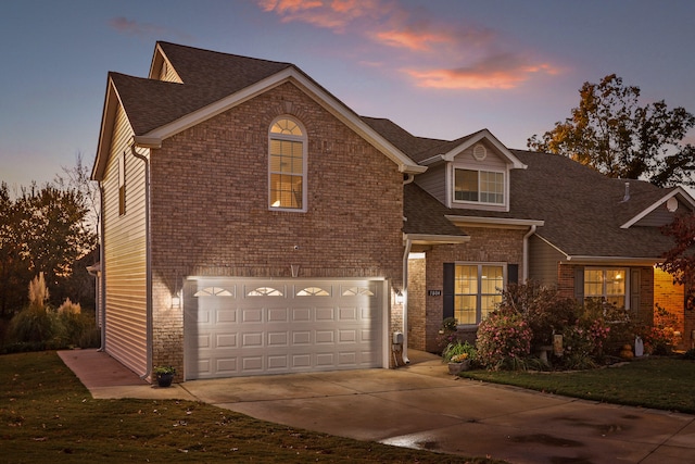 front of property with a garage