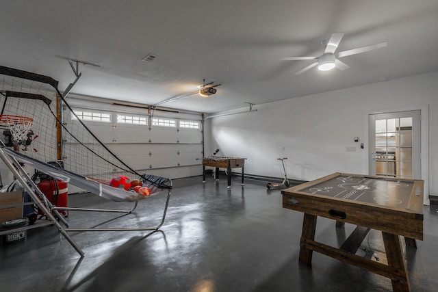 garage featuring stainless steel fridge and ceiling fan