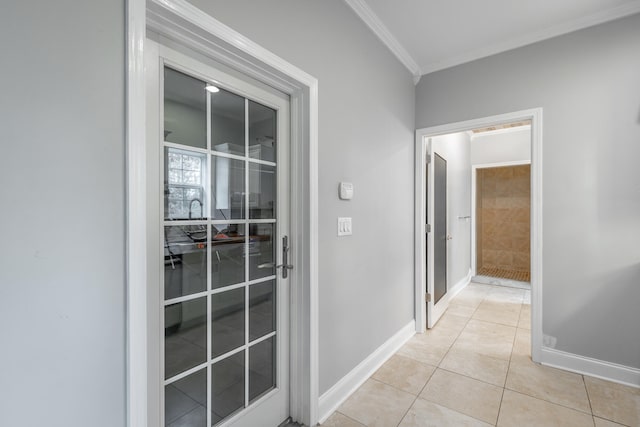 hall featuring crown molding and light tile patterned flooring