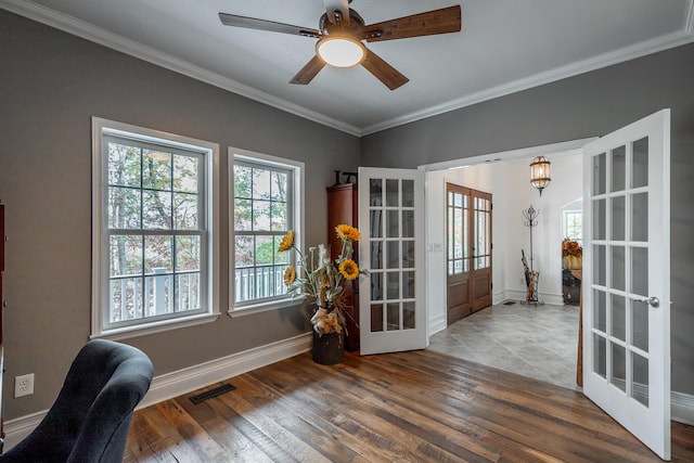 office space with french doors, hardwood / wood-style flooring, ceiling fan, and crown molding