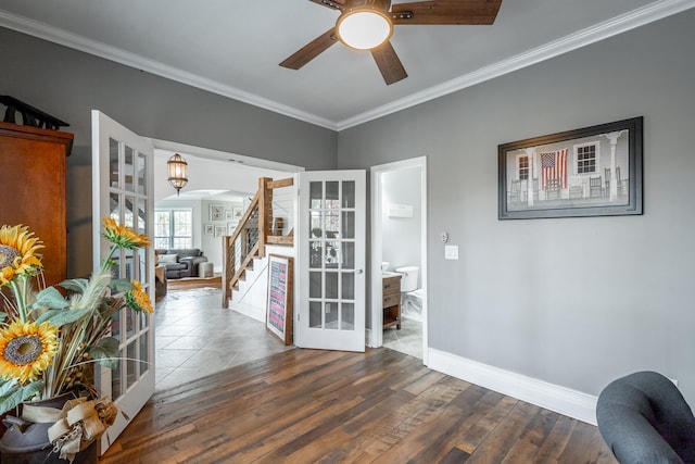 interior space with french doors, dark hardwood / wood-style floors, and ornamental molding