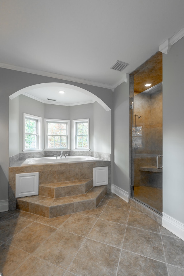 bathroom featuring tile patterned flooring, a healthy amount of sunlight, and crown molding