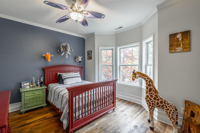 bedroom featuring ceiling fan, dark wood-type flooring, and ornamental molding