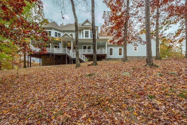 back of property featuring a porch