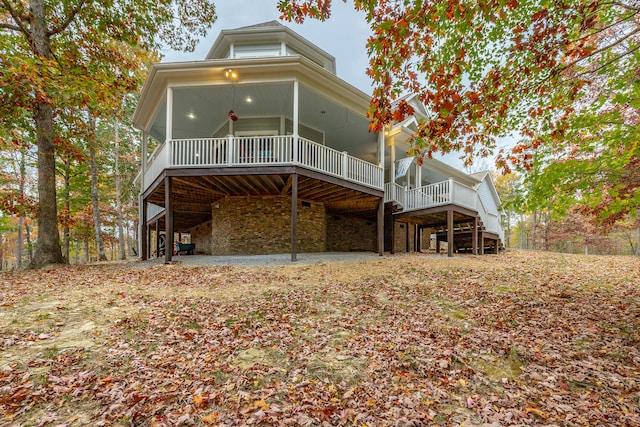 back of property with a wooden deck