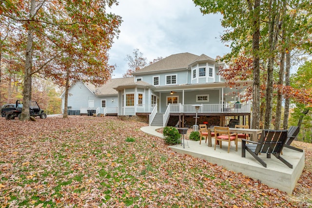 back of property featuring a patio area, ceiling fan, and central AC