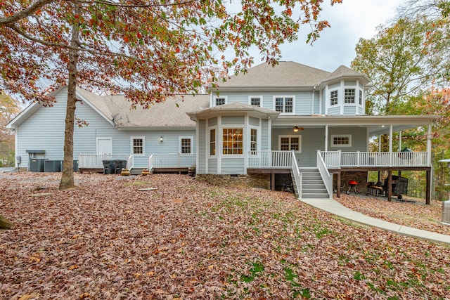 back of property featuring ceiling fan and covered porch