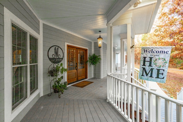 property entrance featuring a porch