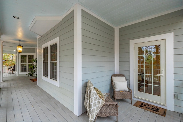 wooden terrace with a porch