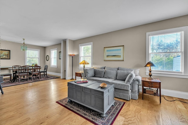 living room with light hardwood / wood-style flooring and a wealth of natural light