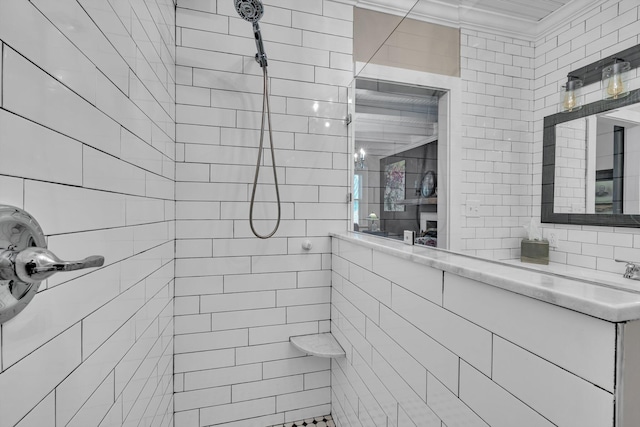 bathroom with tiled shower and tile walls