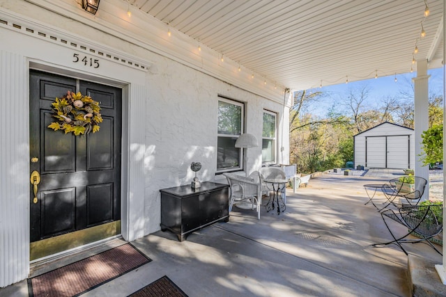 view of exterior entry with covered porch