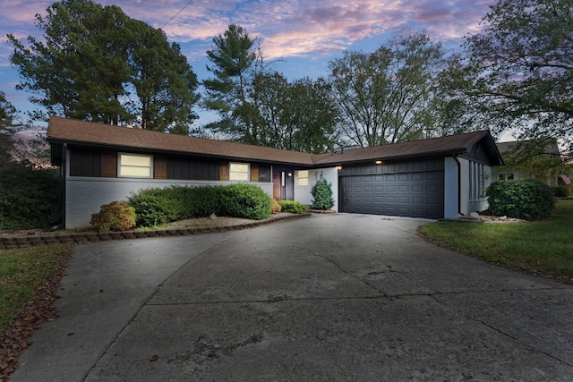 ranch-style house featuring a garage