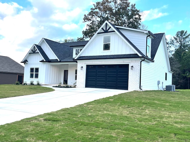 modern inspired farmhouse featuring cooling unit, a front yard, and a garage