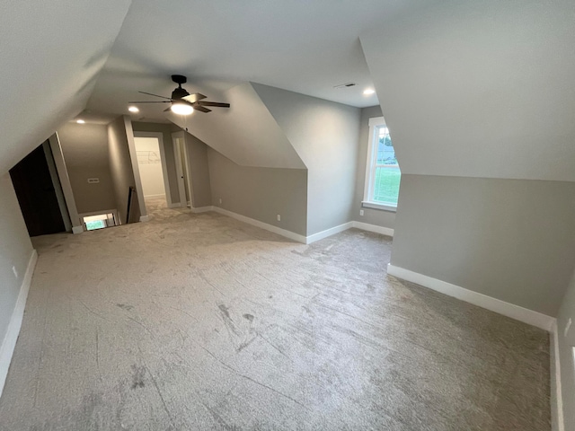 bonus room with carpet, ceiling fan, and lofted ceiling