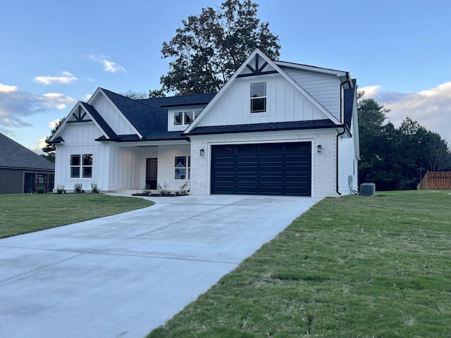 modern farmhouse style home featuring a front lawn and a garage