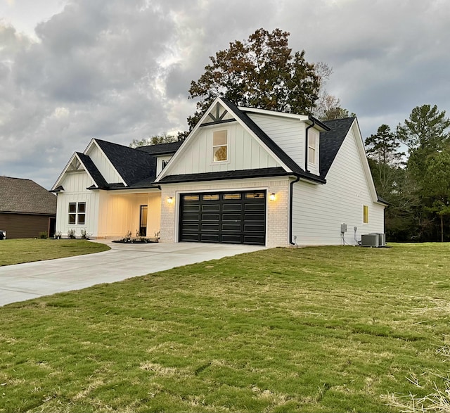 modern farmhouse featuring a front yard, central AC, and a garage