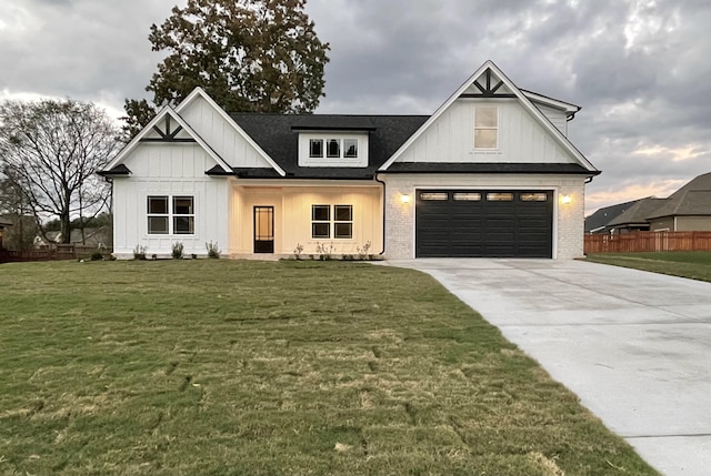 modern farmhouse style home featuring a garage and a front yard