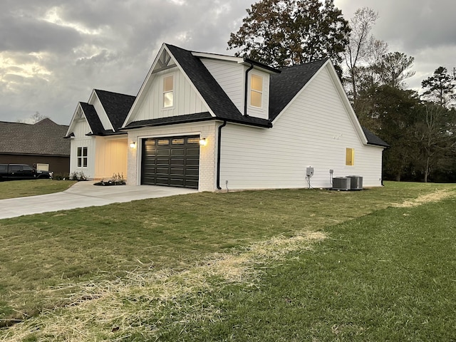 view of home's exterior featuring a yard and a garage