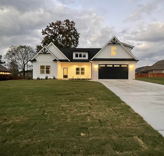 modern farmhouse style home with a garage and a front lawn