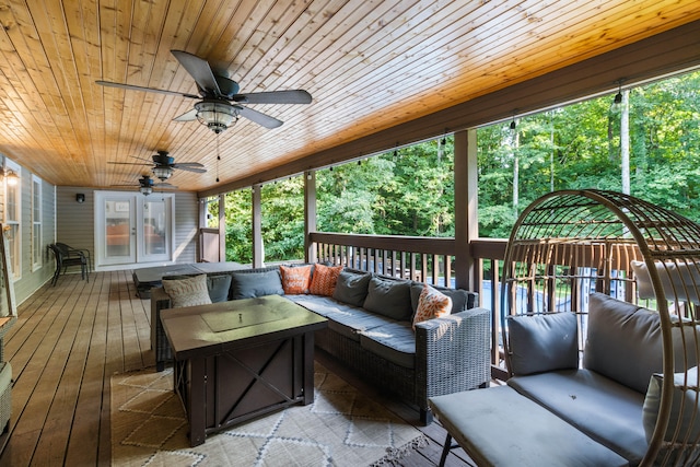 deck featuring an outdoor living space and french doors