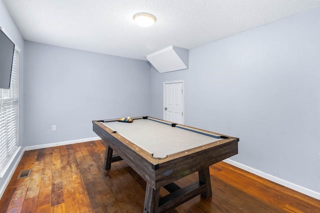 recreation room with a textured ceiling, dark hardwood / wood-style flooring, and pool table