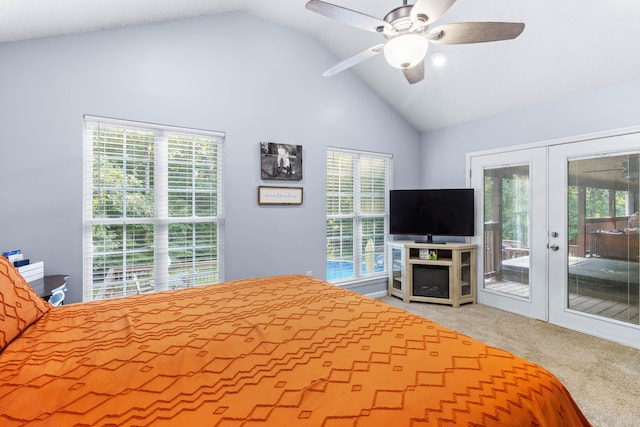 carpeted bedroom featuring ceiling fan, lofted ceiling, access to outside, and multiple windows