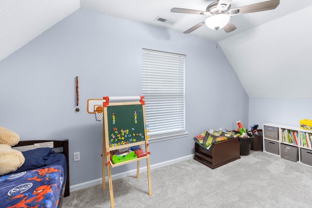 rec room with a textured ceiling, light carpet, ceiling fan, and lofted ceiling