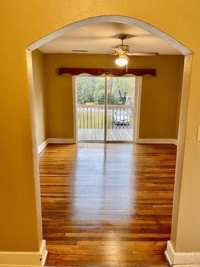 spare room featuring hardwood / wood-style floors and ceiling fan