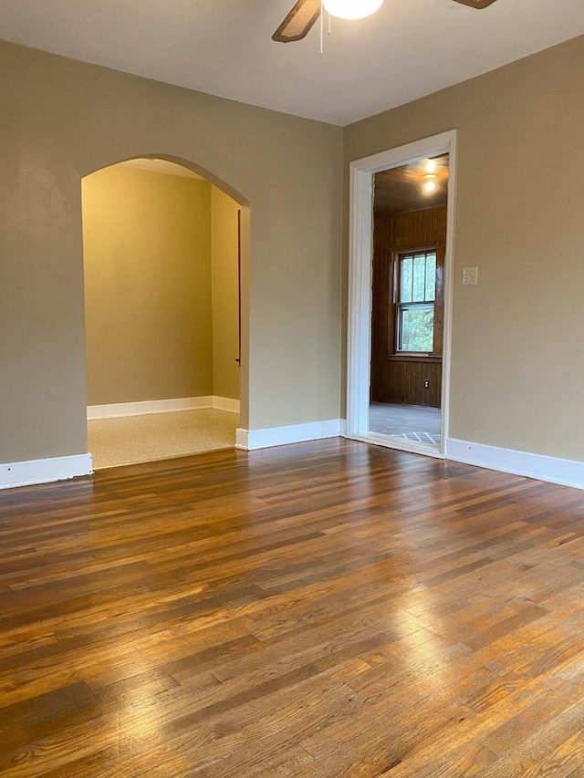 spare room with hardwood / wood-style floors and ceiling fan